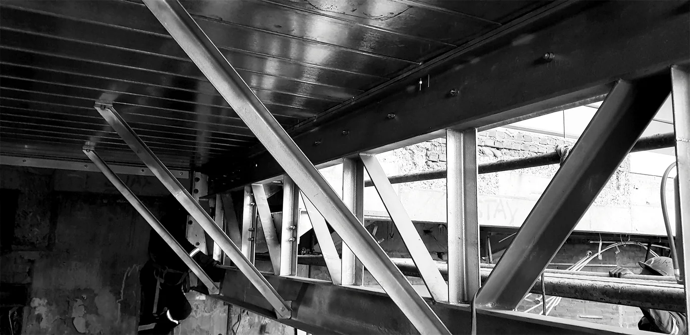 Structural-steel roof trusses viewed from inside a building